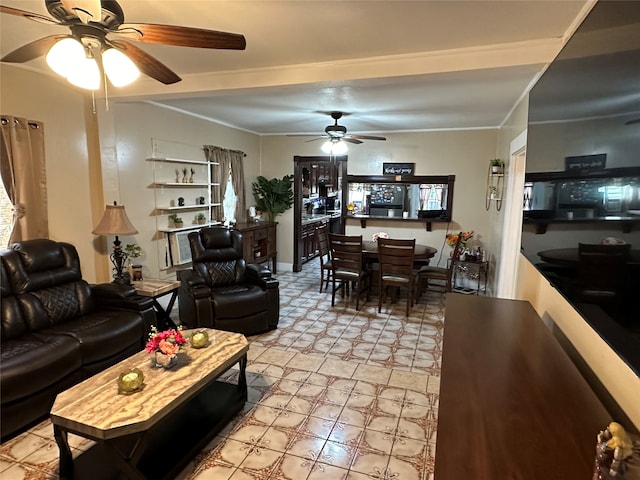 living room featuring ceiling fan, ornamental molding, and light tile patterned floors