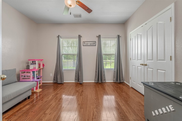 unfurnished room with light hardwood / wood-style flooring and ceiling fan