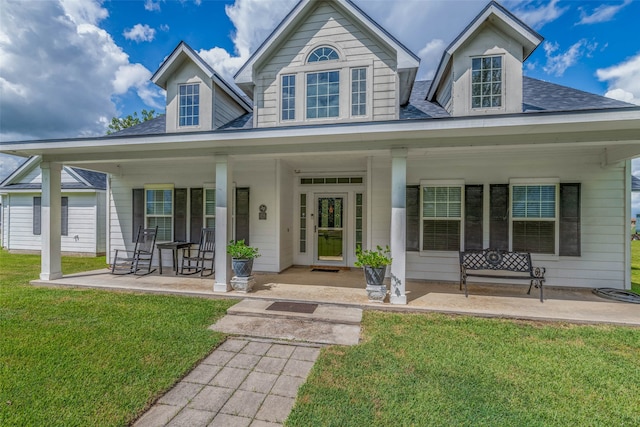 view of front of home featuring a porch and a front lawn