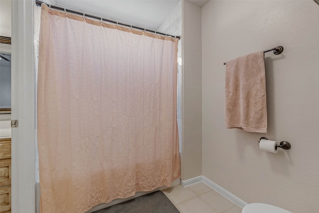 bathroom featuring vanity, toilet, curtained shower, and tile patterned flooring