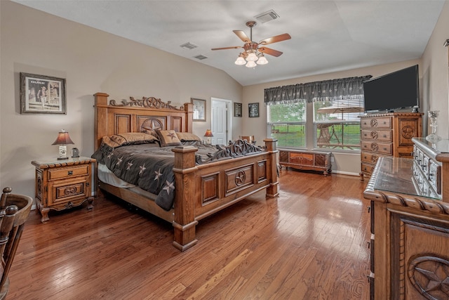 bedroom with lofted ceiling, ceiling fan, and hardwood / wood-style flooring