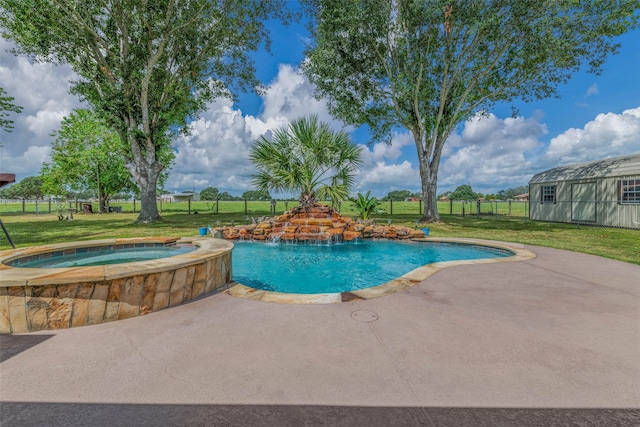 view of swimming pool featuring an in ground hot tub, a lawn, and a patio area