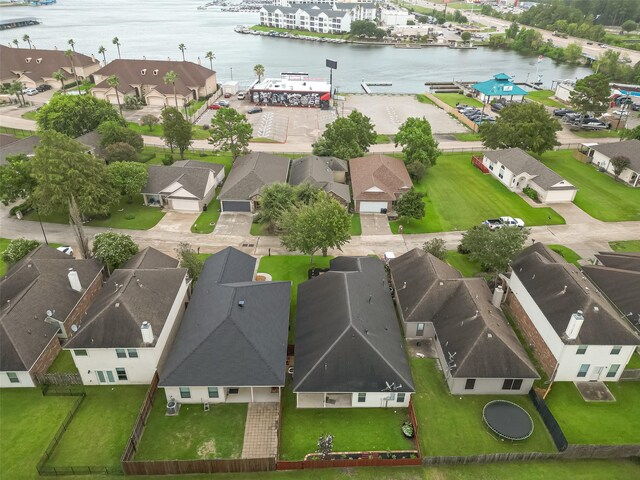 birds eye view of property featuring a water view and a residential view