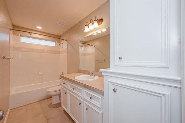 bathroom featuring visible vents, toilet, shower / tub combination, tile patterned floors, and vanity