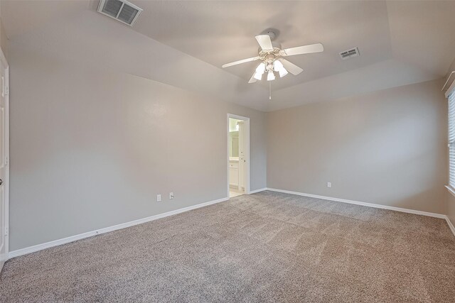 unfurnished room with baseboards, visible vents, and ceiling fan