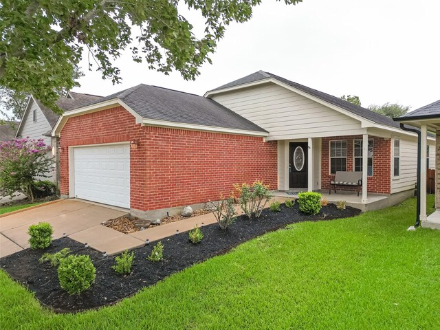 single story home with a front lawn, a garage, and covered porch