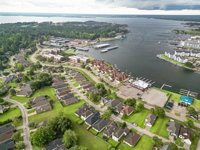 aerial view with a residential view and a water view