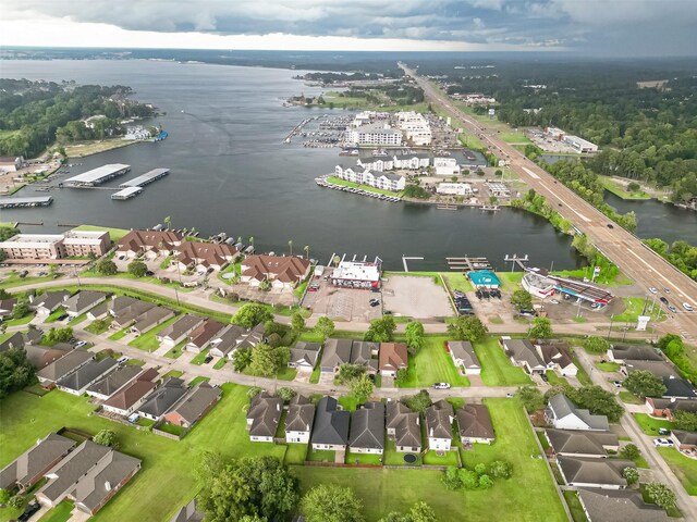 drone / aerial view with a water view and a residential view