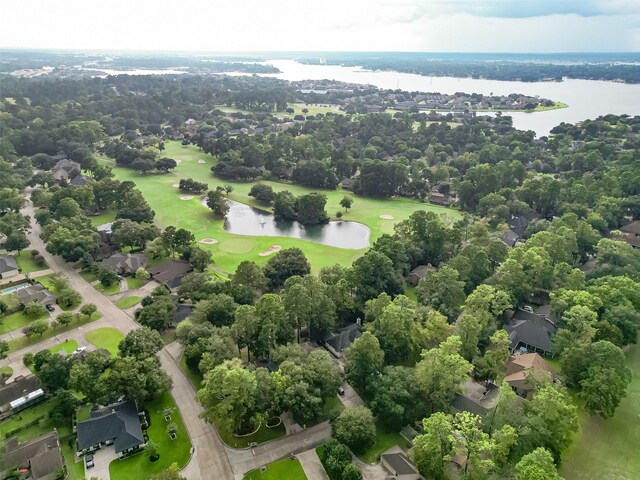 bird's eye view featuring view of golf course and a water view