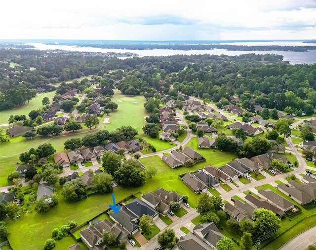 birds eye view of property with a water view and a residential view