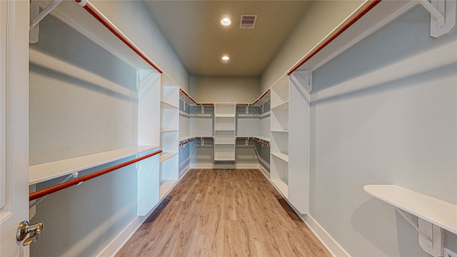 spacious closet featuring light hardwood / wood-style floors