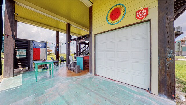 garage featuring wooden walls