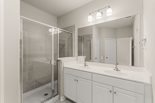 bathroom with vanity and walk in shower