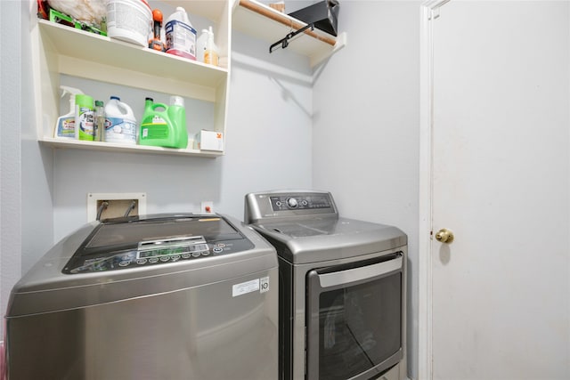 laundry area with independent washer and dryer