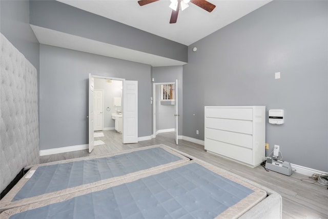 unfurnished bedroom featuring light hardwood / wood-style floors, ceiling fan, and ensuite bathroom