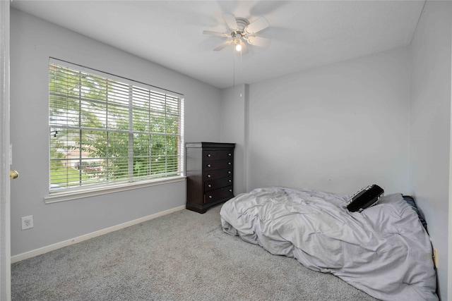 bedroom with ceiling fan and carpet