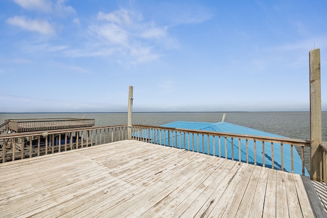 wooden deck featuring a water view