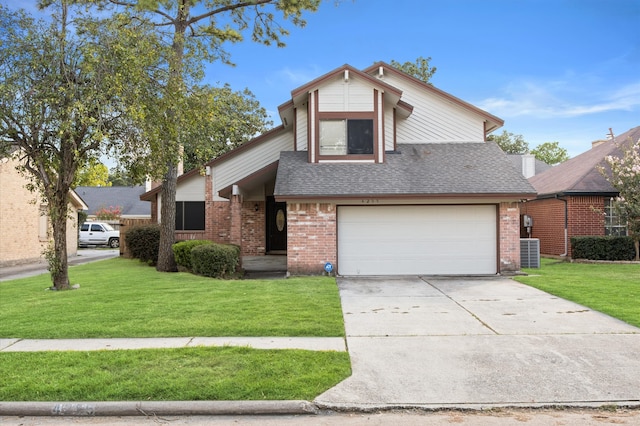 view of front of house featuring a front yard, a garage, and central AC unit