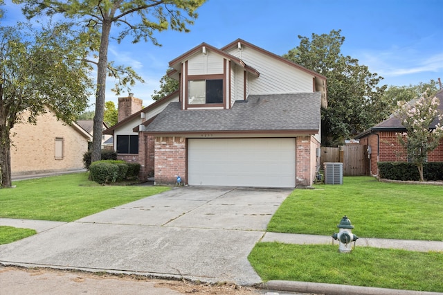 view of front of house featuring a garage, a front yard, and central AC