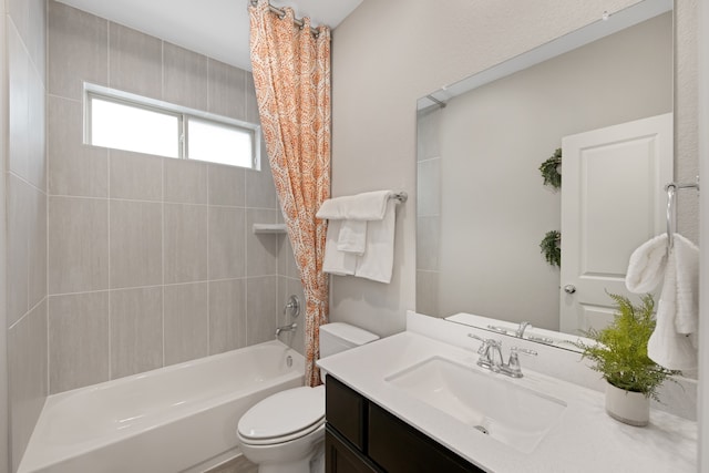 full bathroom featuring shower / bath combo with shower curtain, vanity, and toilet