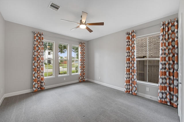 spare room featuring carpet floors and ceiling fan