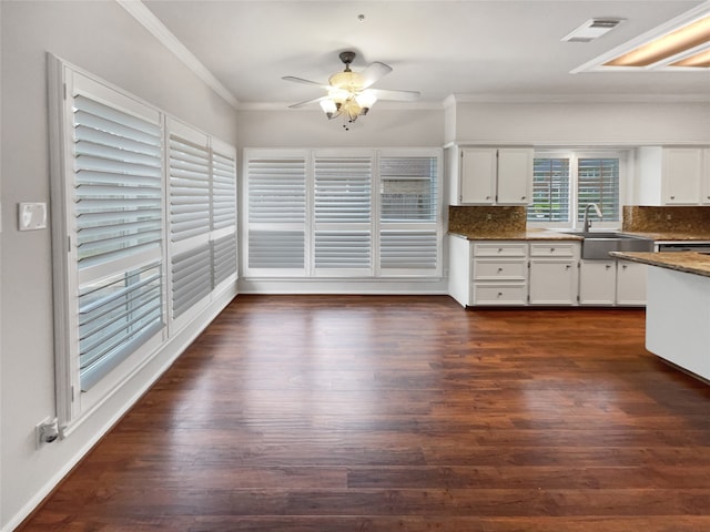 kitchen featuring crown molding, dark wood-type flooring, ceiling fan, and white cabinets