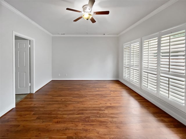 spare room with crown molding, ceiling fan, and dark hardwood / wood-style floors