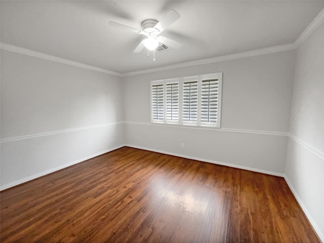 spare room with ceiling fan, dark hardwood / wood-style floors, and crown molding