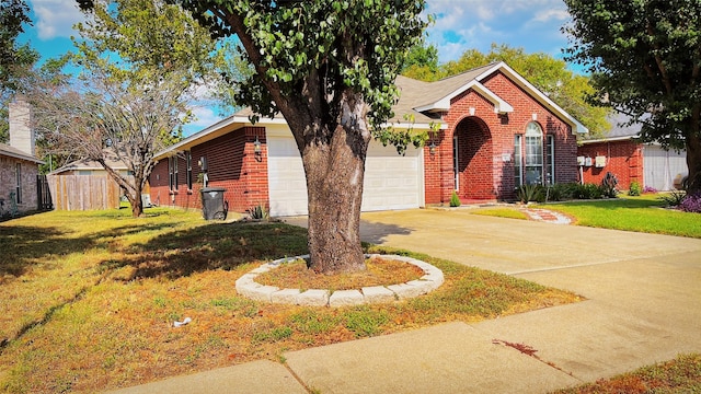 view of front of home with a front lawn and a garage