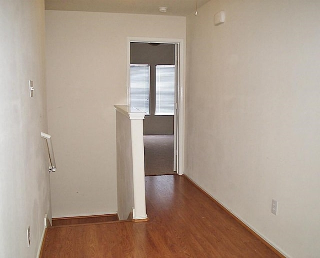 corridor featuring hardwood / wood-style floors