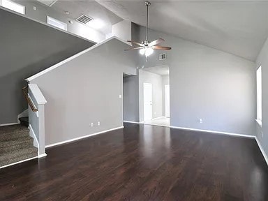 interior space featuring high vaulted ceiling, ceiling fan, and dark hardwood / wood-style flooring