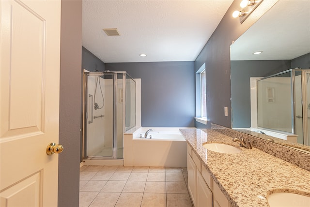 bathroom with vanity, plus walk in shower, and tile patterned flooring