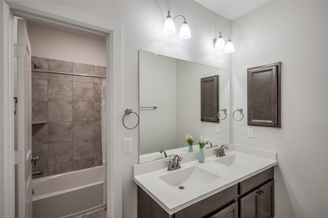 bathroom featuring vanity and shower / bath combination with curtain