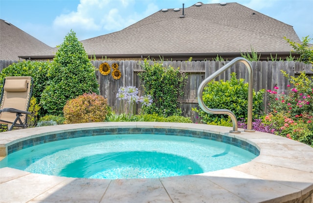 view of pool featuring an in ground hot tub