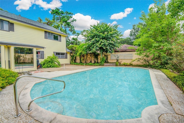 view of swimming pool with a patio