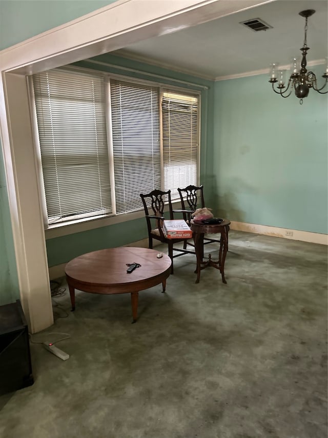 sitting room featuring a chandelier, crown molding, and carpet floors