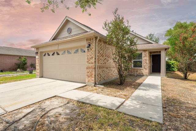 single story home with a garage