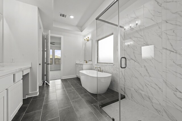 bathroom featuring tile patterned floors, a wealth of natural light, separate shower and tub, and vanity