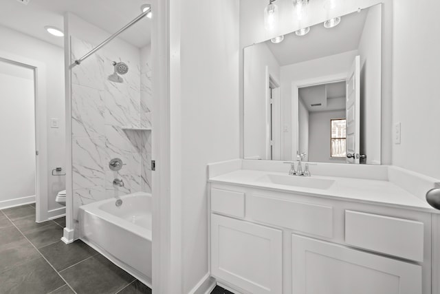 full bathroom featuring tiled shower / bath combo, tile patterned floors, vanity, and toilet