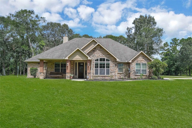 craftsman-style home with a front yard