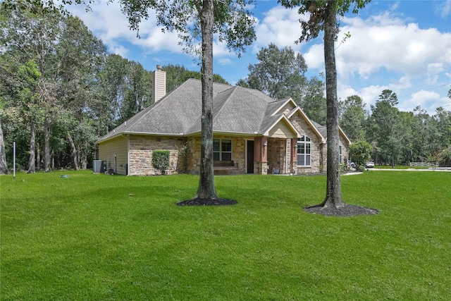 view of front of house featuring a front yard and central air condition unit