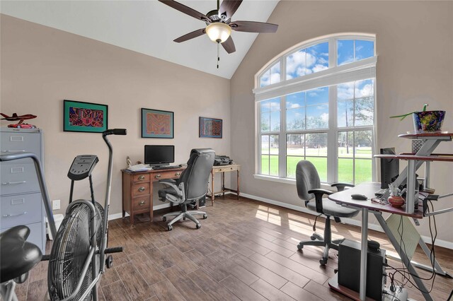 home office featuring high vaulted ceiling, ceiling fan, and wood-type flooring