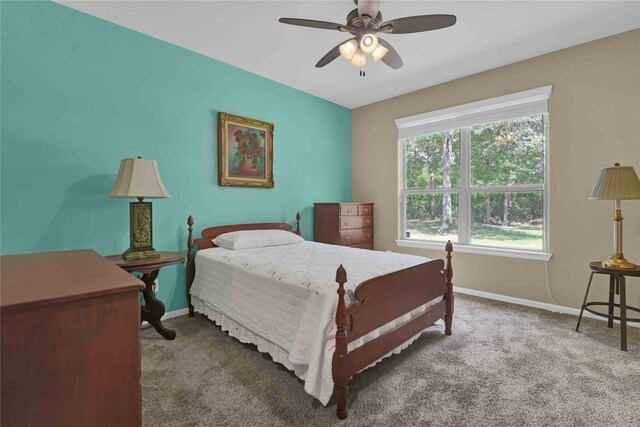 bedroom with ceiling fan and carpet floors