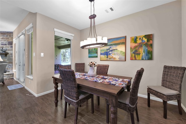 dining room featuring dark hardwood / wood-style flooring