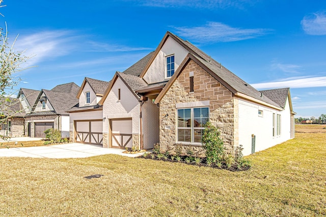 view of front of home with a front lawn and a garage