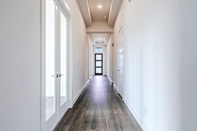 hall with dark wood-type flooring