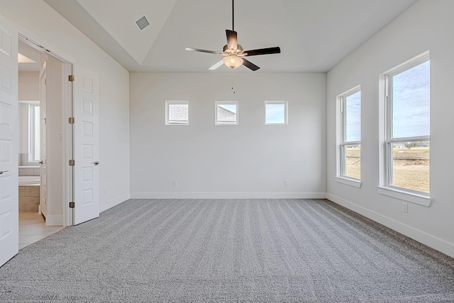 unfurnished room with ceiling fan and light carpet