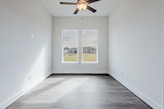 unfurnished room with ceiling fan and hardwood / wood-style floors