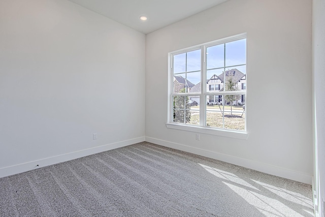 unfurnished room featuring carpet