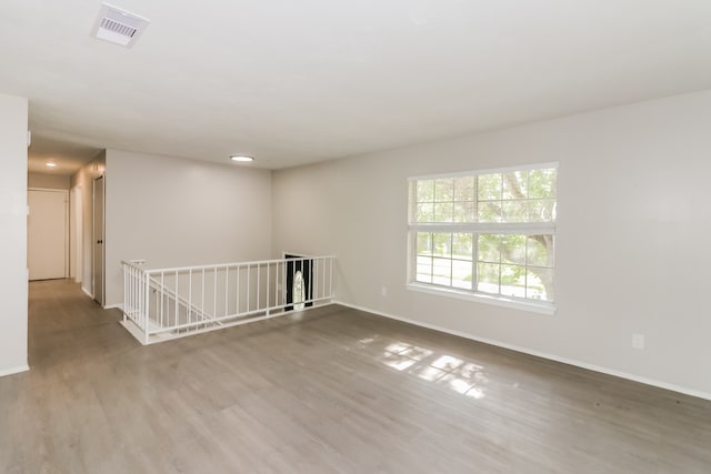 spare room featuring hardwood / wood-style flooring